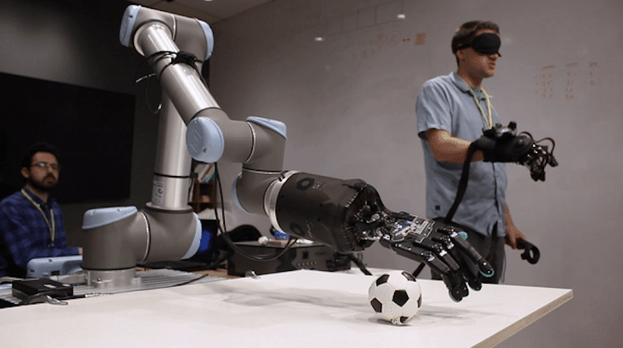 A robotic arm playing with a ball
